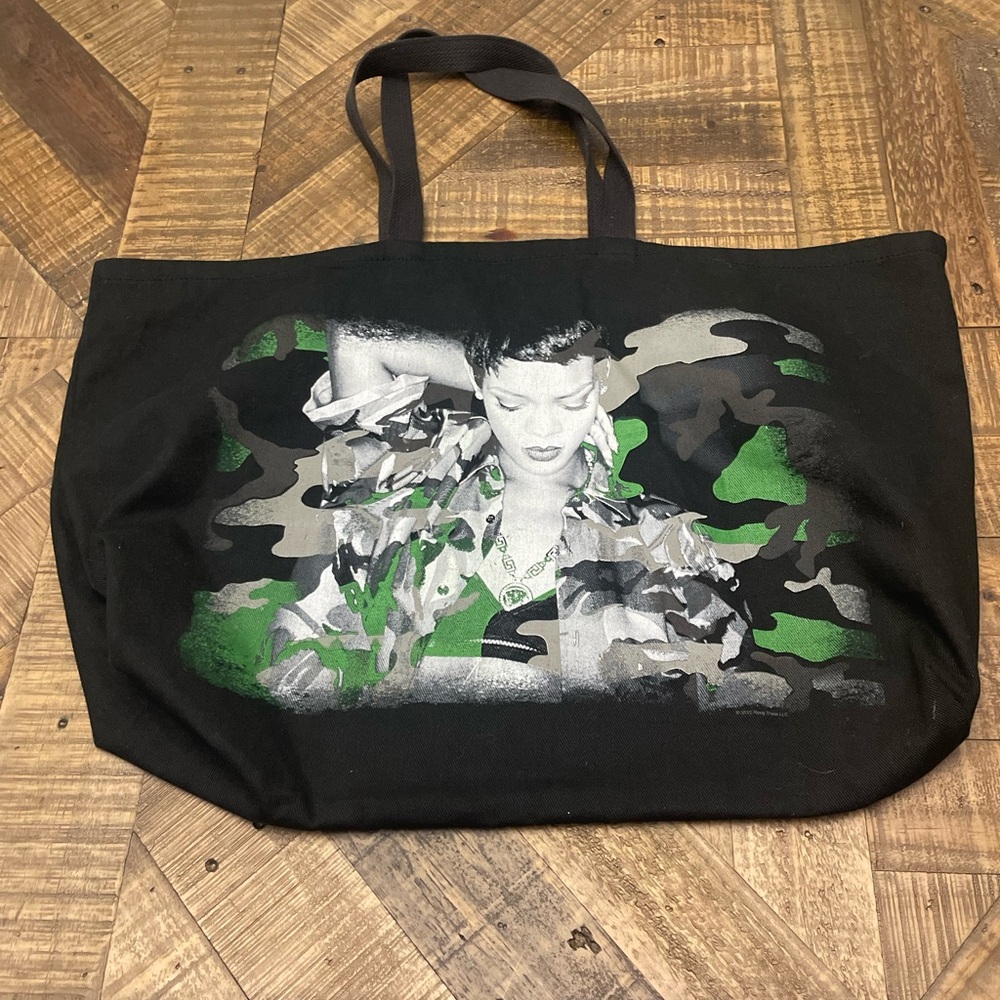 black canvas tote features a graphic of Rihanna from 2013 Diamonds World Tour